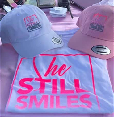 She Still Smiles merchandise sold at Tricky Inc Wine and Music Fest